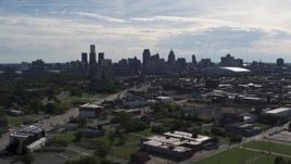 5.7K aerial stock footage of the city's skyline, descend near brick industrial buildings, Downtown Detroit, Michigan Aerial Stock Footage | DX0002_195_018