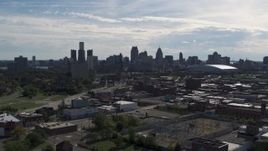 5.7K aerial stock footage ascend toward the city's skyline from brick industrial buildings, Downtown Detroit, Michigan Aerial Stock Footage | DX0002_195_019