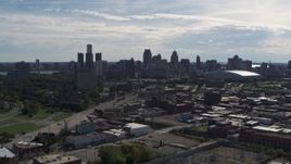 5.7K aerial stock footage a reverse view of the city's skyline from brick industrial buildings, Downtown Detroit, Michigan Aerial Stock Footage | DX0002_195_020