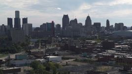 5.7K aerial stock footage focus on the city's skyline while flying by brick buildings, Downtown Detroit, Michigan Aerial Stock Footage | DX0002_195_026