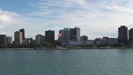 5.7K aerial stock footage of approaching office buildings and Canadian flag by the river in Windsor, Ontario, Canada Aerial Stock Footage | DX0002_196_005