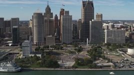 5.7K aerial stock footage slowly orbit tall skyscrapers and Hart Plaza, Downtown Detroit, Michigan Aerial Stock Footage | DX0002_196_011
