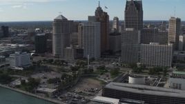 5.7K aerial stock footage of orbiting tall city skyscrapers behind Hart Plaza, Downtown Detroit, Michigan Aerial Stock Footage | DX0002_196_014