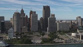 5.7K aerial stock footage orbit of tall city skyscrapers behind Hart Plaza, Downtown Detroit, Michigan Aerial Stock Footage | DX0002_196_015
