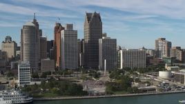 5.7K aerial stock footage a view of tall city skyscrapers beside Hart Plaza, Downtown Detroit, Michigan Aerial Stock Footage | DX0002_196_016