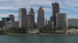 5.7K aerial stock footage fly over river and Hart Plaza to approach tall city skyscrapers, Downtown Detroit, Michigan Aerial Stock Footage | DX0002_196_018