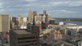 5.7K aerial stock footage view of a group of skyscrapers, descend to reveal office tower in Downtown Detroit, Michigan Aerial Stock Footage | DX0002_196_039