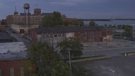 5.7K aerial stock footage of orbiting an abandoned factory building at sunset, Detroit, Michigan Aerial Stock Footage | DX0002_197_008