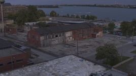 5.7K aerial stock footage of an orbit of an abandoned factory building at sunset, Detroit, Michigan Aerial Stock Footage | DX0002_197_009