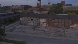 5.7K aerial stock footage of an abandoned factory building at sunset, Detroit, Michigan Aerial Stock Footage | DX0002_197_010