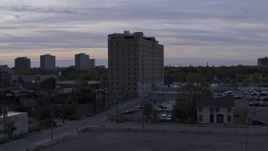5.7K aerial stock footage of orbiting an apartment building at sunset, Detroit, Michigan Aerial Stock Footage | DX0002_197_017