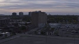 5.7K aerial stock footage focus on an apartment building during descent at sunset, Detroit, Michigan Aerial Stock Footage | DX0002_197_024