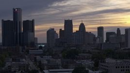 5.7K aerial stock footage of flying by the city's skyline at sunset, Downtown Detroit, Michigan Aerial Stock Footage | DX0002_197_026
