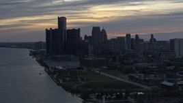 5.7K aerial stock footage of GM Renaissance Center and the city's skyline seen from river at sunset, Downtown Detroit, Michigan Aerial Stock Footage | DX0002_197_034