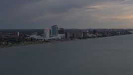 5.7K aerial stock footage of the city's skyline on the other side of the river at sunset, Windsor, Ontario, Canada Aerial Stock Footage | DX0002_197_045