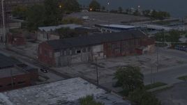 5.7K aerial stock footage of orbiting an abandoned brick building at sunset, Detroit, Michigan Aerial Stock Footage | DX0002_197_049