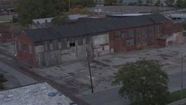 5.7K aerial stock footage orbit an abandoned brick building at sunset, Detroit, Michigan Aerial Stock Footage | DX0002_197_050