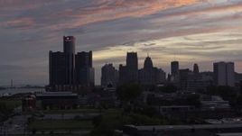 5.7K aerial stock footage of flying low with a view of the city's towering skyscrapers at sunset, Downtown Detroit, Michigan Aerial Stock Footage | DX0002_198_001