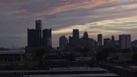 5.7K aerial stock footage of flying low past the city's towering skyscrapers at sunset, Downtown Detroit, Michigan Aerial Stock Footage | DX0002_198_002