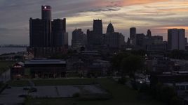 5.7K aerial stock footage of ascending toward the city's towering skyscrapers at sunset, Downtown Detroit, Michigan Aerial Stock Footage | DX0002_198_003