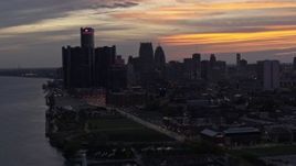 5.7K aerial stock footage the city's towering skyscrapers at sunset seen from the Detroit River, Downtown Detroit, Michigan Aerial Stock Footage | DX0002_198_007