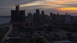 5.7K aerial stock footage the city's towering skyscrapers at sunset seen during descent, Downtown Detroit, Michigan Aerial Stock Footage | DX0002_198_008