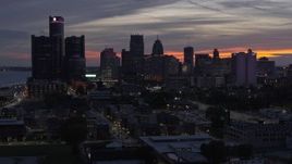 5.7K aerial stock footage of flying by the city's towering skyscrapers at twilight, Downtown Detroit, Michigan Aerial Stock Footage | DX0002_198_009