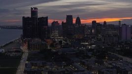 5.7K aerial stock footage of slowly approach and flying by the city's towering skyscrapers at twilight, Downtown Detroit, Michigan Aerial Stock Footage | DX0002_198_011