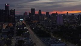 5.7K aerial stock footage of slowly flying away from the city's towering skyscrapers at twilight, Downtown Detroit, Michigan Aerial Stock Footage | DX0002_198_012