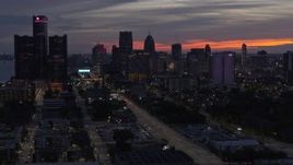 5.7K aerial stock footage of slowly passing the city's towering skyscrapers at twilight, Downtown Detroit, Michigan Aerial Stock Footage | DX0002_198_013