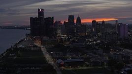 5.7K aerial stock footage of flying past the city's tall skyscrapers at twilight, Downtown Detroit, Michigan Aerial Stock Footage | DX0002_198_014