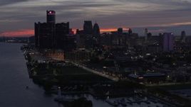 5.7K aerial stock footage of the city's tall skyscrapers by the Detroit River at twilight, Downtown Detroit, Michigan Aerial Stock Footage | DX0002_198_015