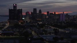 5.7K aerial stock footage of flying by tall skyscrapers at twilight in Downtown Detroit, Michigan Aerial Stock Footage | DX0002_198_016