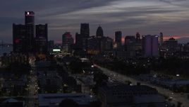 5.7K aerial stock footage of slowly flying by tall skyscrapers at twilight in Downtown Detroit, Michigan Aerial Stock Footage | DX0002_198_017