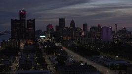 5.7K aerial stock footage passing by giant skyscrapers at twilight in Downtown Detroit, Michigan Aerial Stock Footage | DX0002_198_020