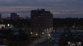 5.7K aerial stock footage of orbiting an apartment building at twilight, Detroit, Michigan Aerial Stock Footage | DX0002_198_021