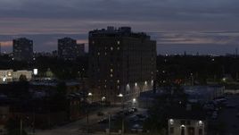 5.7K aerial stock footage orbit an apartment building at twilight, Detroit, Michigan Aerial Stock Footage | DX0002_198_022