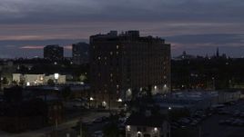 5.7K aerial stock footage of circling an apartment building at twilight, Detroit, Michigan Aerial Stock Footage | DX0002_198_023