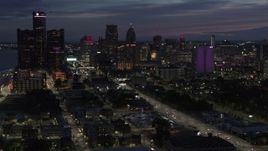 5.7K aerial stock footage of ascending away from the city's skyline at twilight in Downtown Detroit, Michigan Aerial Stock Footage | DX0002_198_027