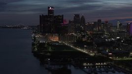 5.7K aerial stock footage of the city's skyline, seen from the river at twilight in Downtown Detroit, Michigan Aerial Stock Footage | DX0002_198_029
