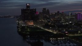 5.7K aerial stock footage of the city's skyline, seen while flying over the river at twilight in Downtown Detroit, Michigan Aerial Stock Footage | DX0002_198_030