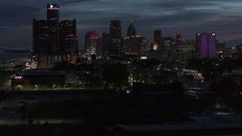 5.7K aerial stock footage of the city's skyline, seen during descent at twilight in Downtown Detroit, Michigan Aerial Stock Footage | DX0002_198_031