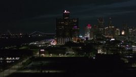 5.7K aerial stock footage GM Renaissance Center while flying toward river at night, Downtown Detroit, Michigan Aerial Stock Footage | DX0002_198_042
