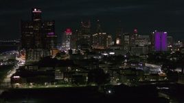 5.7K aerial stock footage focus on the skyline during ascent at night, Downtown Detroit, Michigan Aerial Stock Footage | DX0002_198_047