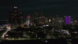 5.7K aerial stock footage focus on the skyline during slow descent at night, Downtown Detroit, Michigan Aerial Stock Footage | DX0002_198_048