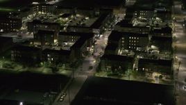 5.7K aerial stock footage approach and orbit Franklin Street and an apartment complex at night, Downtown Detroit, Michigan Aerial Stock Footage | DX0002_198_052