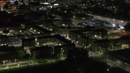 5.7K aerial stock footage descend toward an apartment complex at night, Downtown Detroit, Michigan Aerial Stock Footage | DX0002_198_053