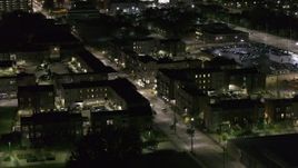5.7K aerial stock footage of orbiting Franklin Street and an apartment complex at night, Downtown Detroit, Michigan Aerial Stock Footage | DX0002_198_054