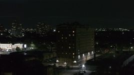 5.7K aerial stock footage of orbiting an apartment building at night, Detroit, Michigan Aerial Stock Footage | DX0002_198_058