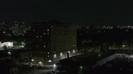 5.7K aerial stock footage of an orbit of an apartment building at night, Detroit, Michigan Aerial Stock Footage | DX0002_198_059